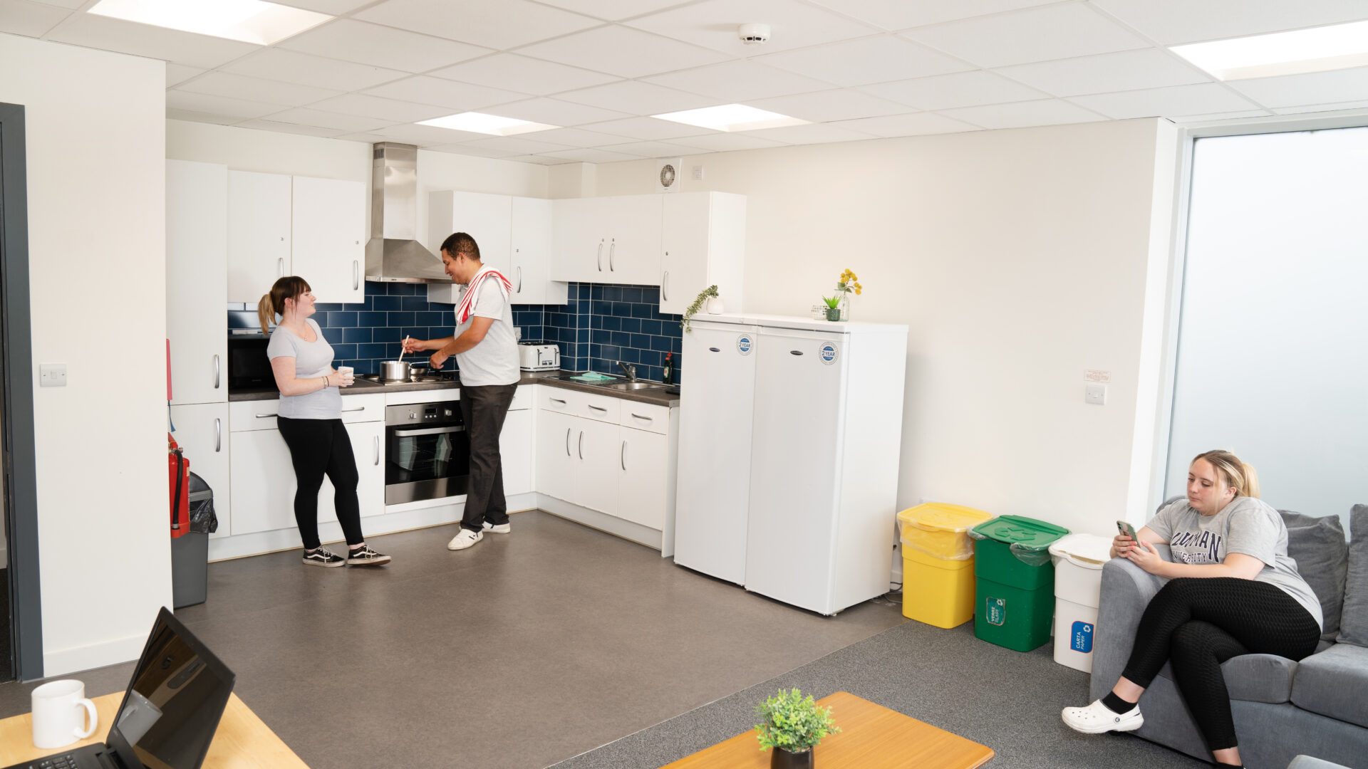 Students in the shared kitchen of Cofton Hall